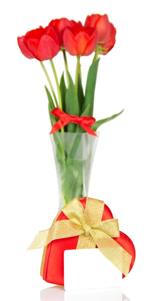 Fine tulips in a vase and a gift box with a tape and the empty card — Stock Photo, Image