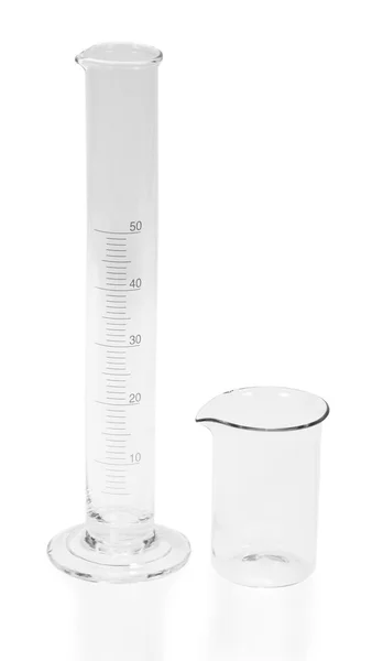 The graduated cylinder and the glass isolated on white — Stock Photo, Image