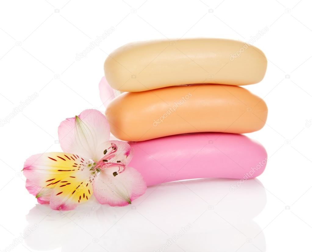 Fragrant toilet soap and the flower isolated on white