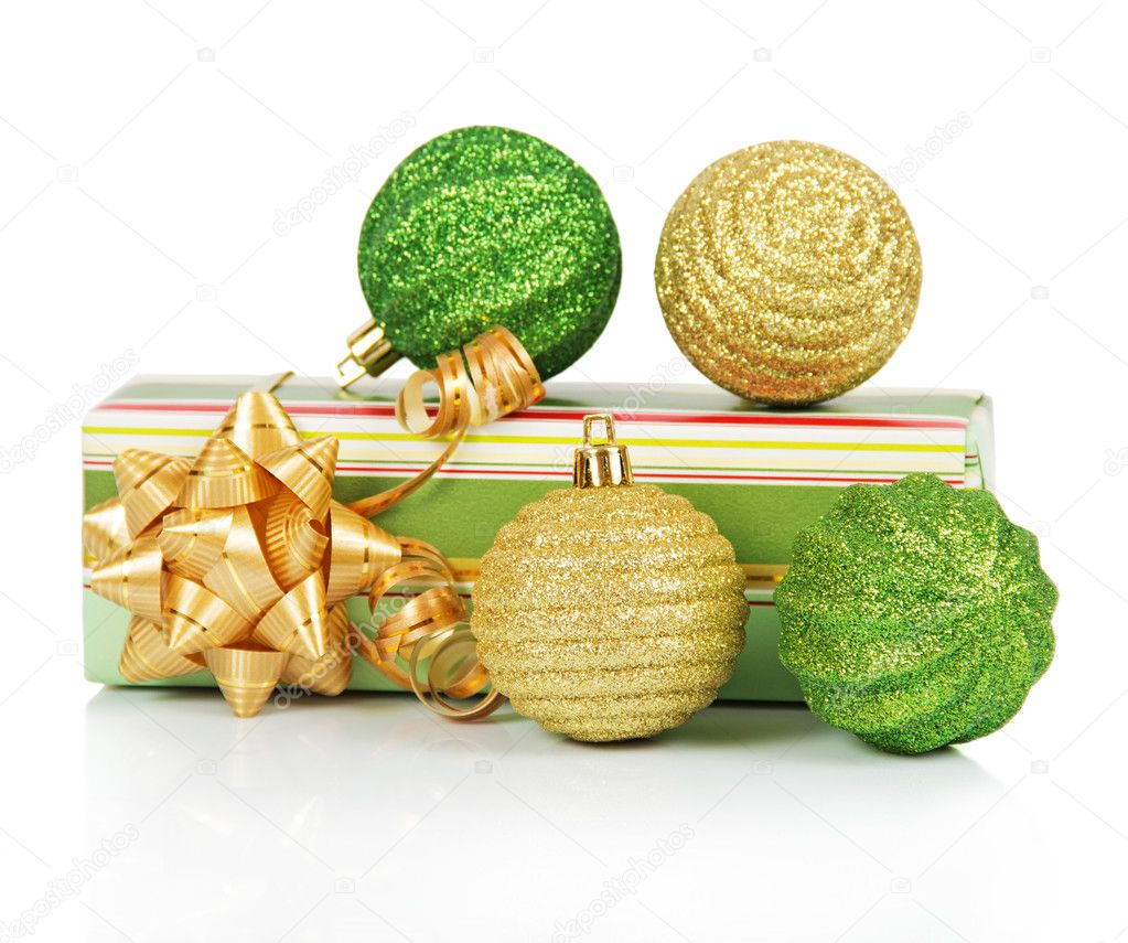 Christmas gift box with gold and green balls isolated on white