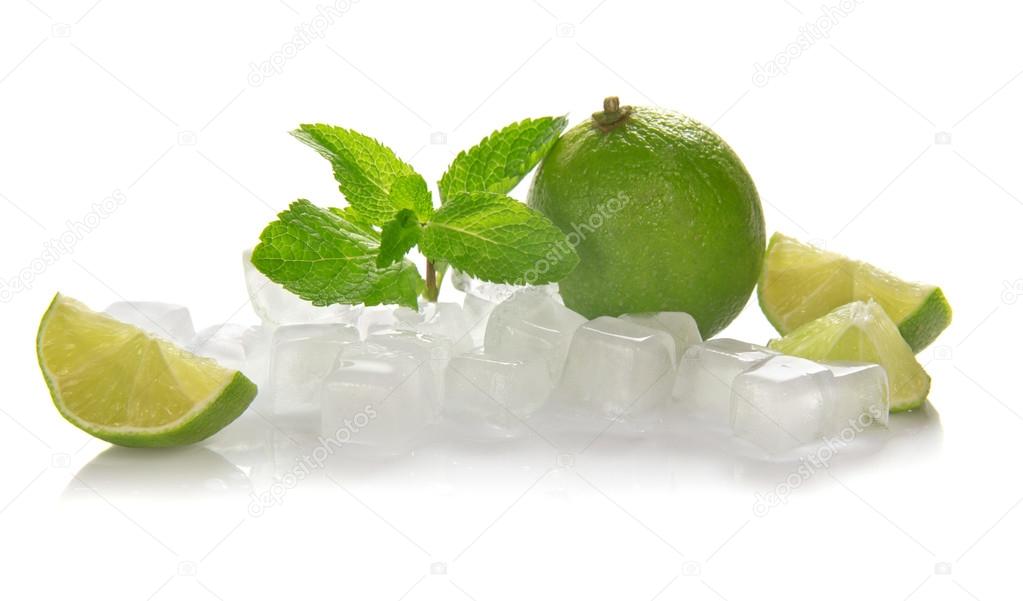 Ice cubes, lime, mint and the slices of a lime isolated on white