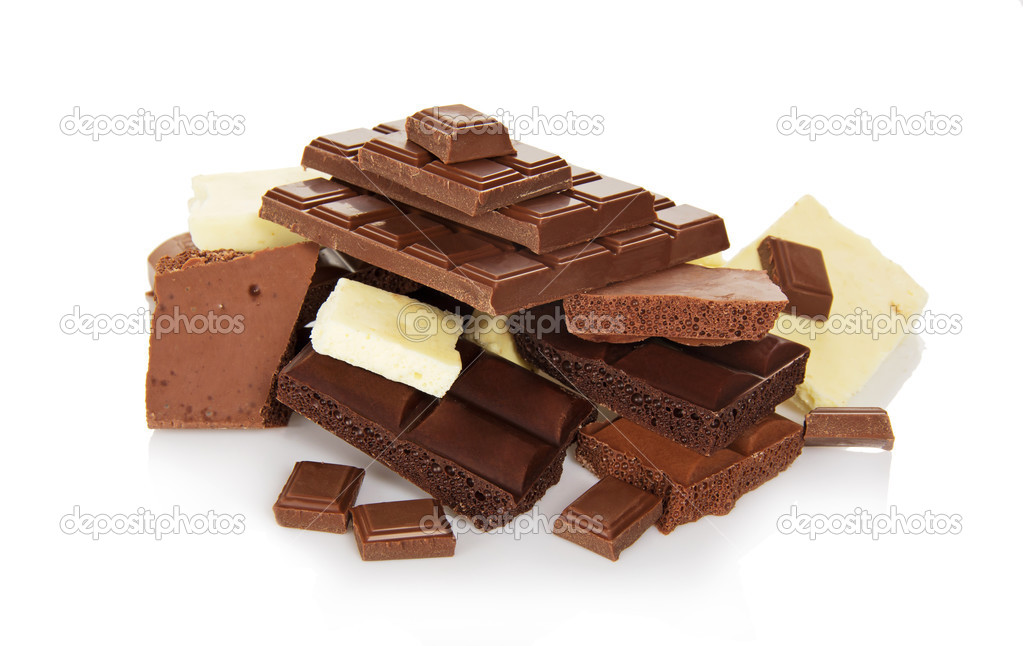 The slices of black, white and milk chocolate isolated on white