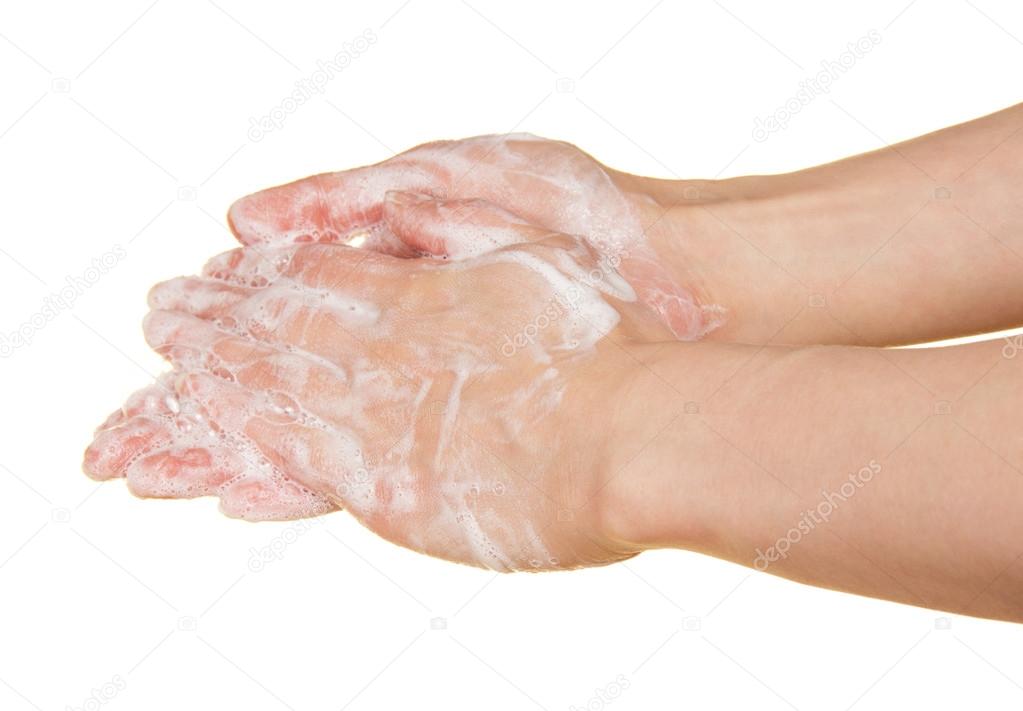 Foam of soap on female hands, isolated on white