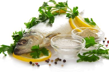Tasty salty fish with the seasonings, isolated on white clipart