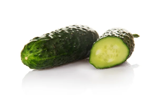 The whole green cucumber and the slice of a cucumber — Stock Photo, Image