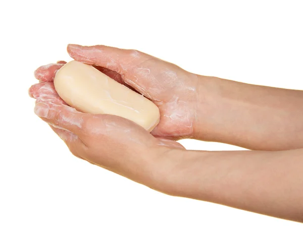 Pieza de jabón fragante en las manos femeninas, aislado en blanco — Foto de Stock