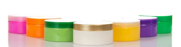 Stack of various cosmetics as border — Stock Photo, Image
