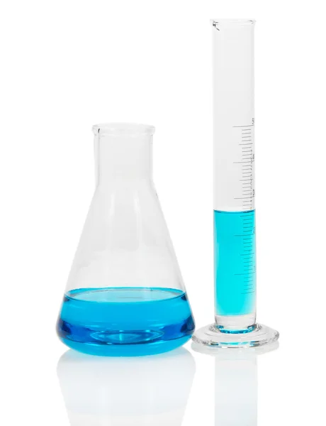 Laboratory glassware with blue liquid isolated on white — Stock Photo, Image