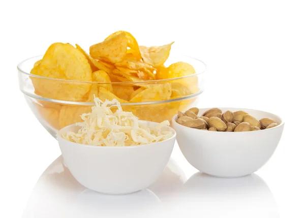 Bowls of snacks isolated on white — Stock Photo, Image