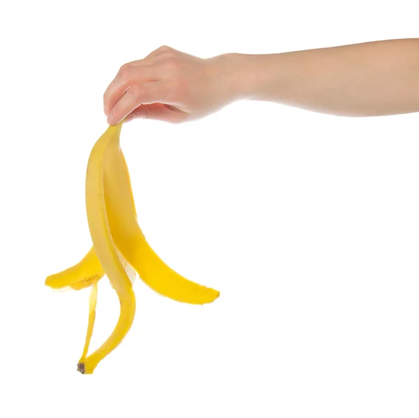 Schale aus Banane in der weiblichen Hand, isoliert auf weiß — Stockfoto