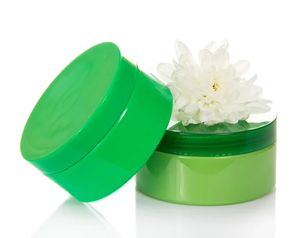 Containers of a different cosmetic creams, and chrysanthemum — Stock Photo, Image