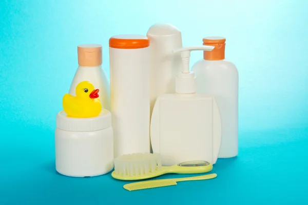 Children's toilet accessories, on a blue background — Stock Photo, Image