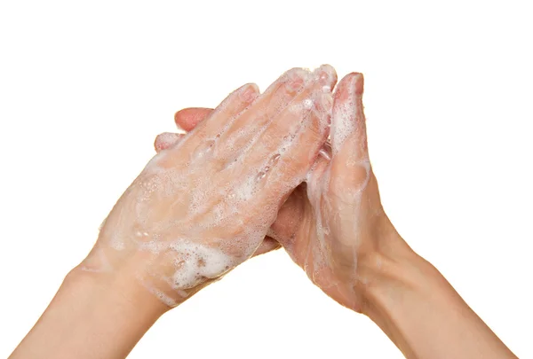 Foam of soap on female hands, isolated on white — Stock Photo, Image