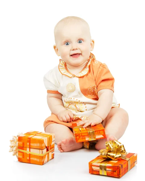 Merry baby with colorful gifts isolated on white — Stock Photo, Image