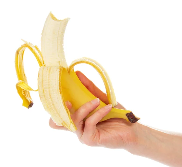 The taken a bite banana in the female hand, isolated on white — Stock Photo, Image