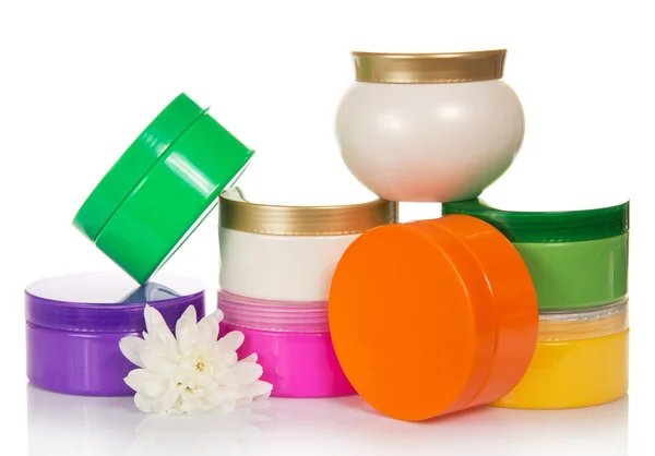 Collection of containers for cosmetic facilities and flower — Stock Photo, Image