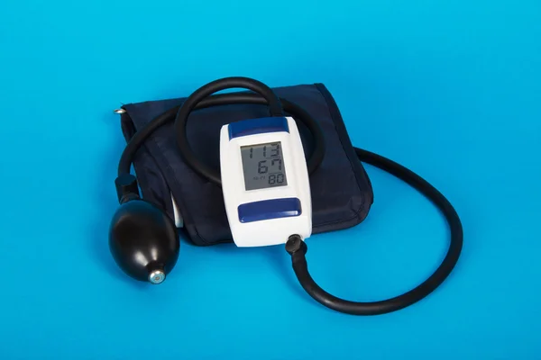 Digital tonometer on blue background — Stock Photo, Image