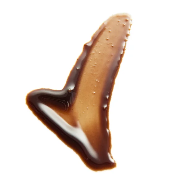 Dabs and the drops of the melted chocolate isolated on white — Stock Photo, Image