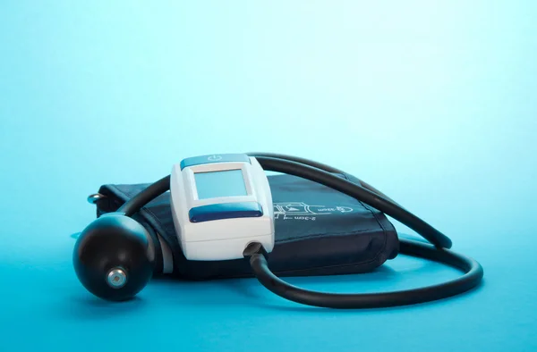 The device for pressure measurement on a blue background — Stock Photo, Image