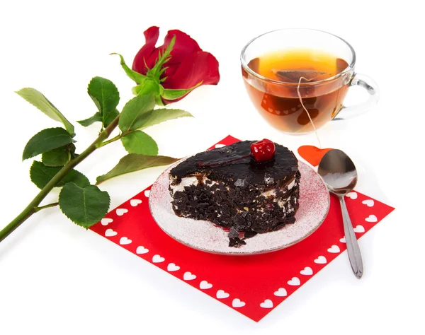 Chocolate cake, hot tea and red rose isolated on white — Stock Photo, Image