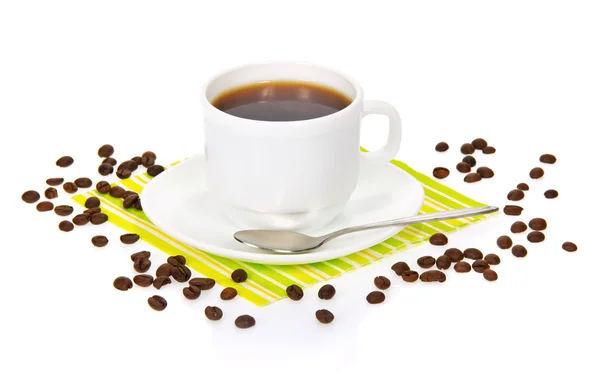 White cup of coffee on a striped napkin with coffee grains isolated on white — Stock Photo, Image