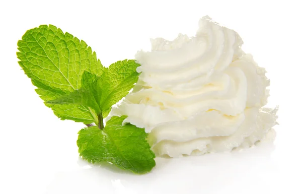 Whipped cream and spearmint leaves, isolated on white — Stock Photo, Image
