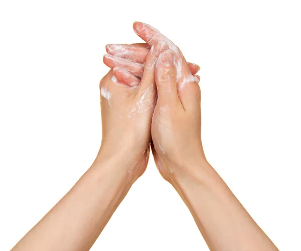 A woman washes her hands with soap. Isolated on white. — Stock Photo, Image