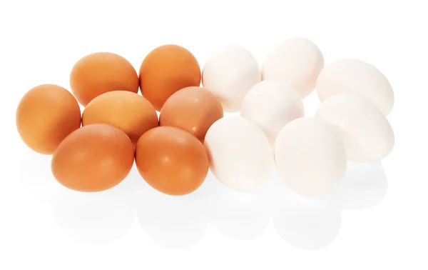 The white and brown eggs isolated on white — Stock Photo, Image