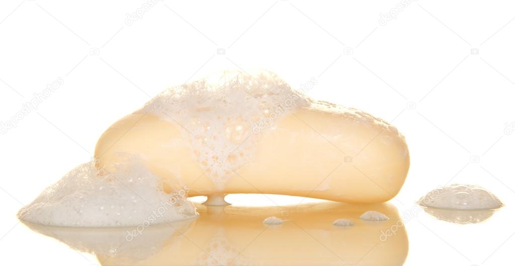 Bar of soap with suds, isolated on white