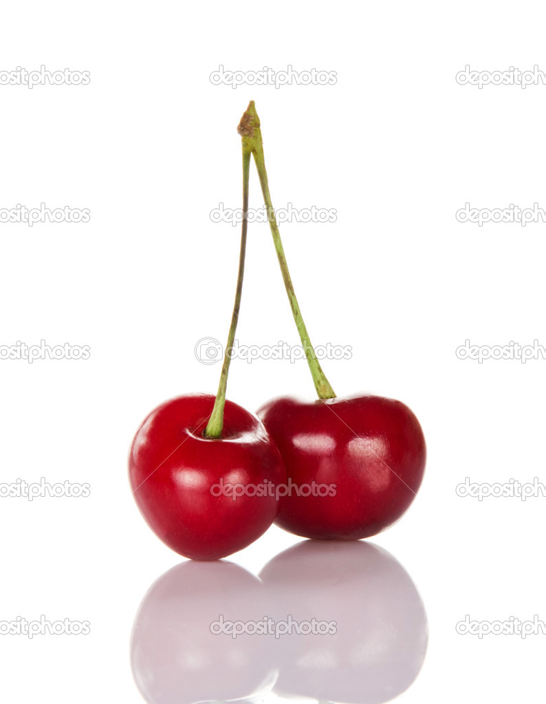 Two red ripe sweet cherries isolated on the white