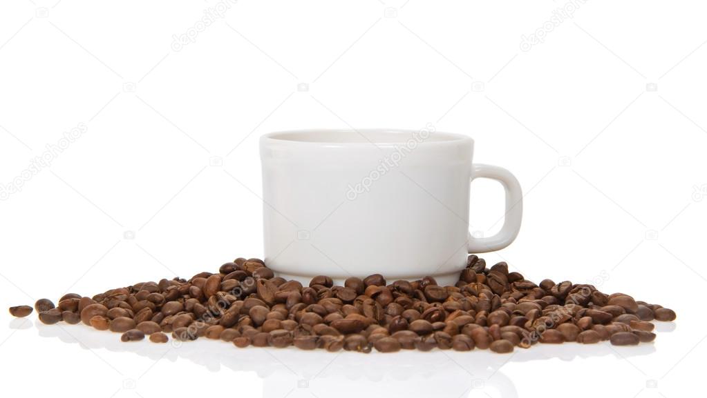 Cup of coffee with coffee the grains, isolated on white