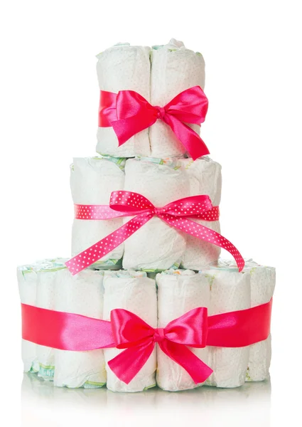 Cake of diapers decorated red ribbons — Stock Photo, Image