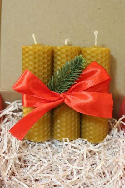 Handmade bee wax candles natural colour in the box. Bee candles good present for Christmas. Beewax eco bio candles aromatherapy.