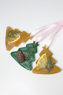 Florentine beeswax sachet shaped as Christmas tree on white background. Handmade aroma sachet. Wax sachet freshener Christmas themed. clipart