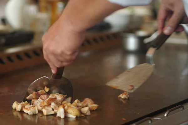 Chef Mixing Nicely Cut Pieces Chicken Breast While Grilling Them — Stock Photo, Image