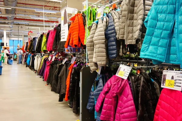 POZNAN, POLAND - Oct 01, 2013: The aisles full of puffy colorful winter jackets in the Decathlon store