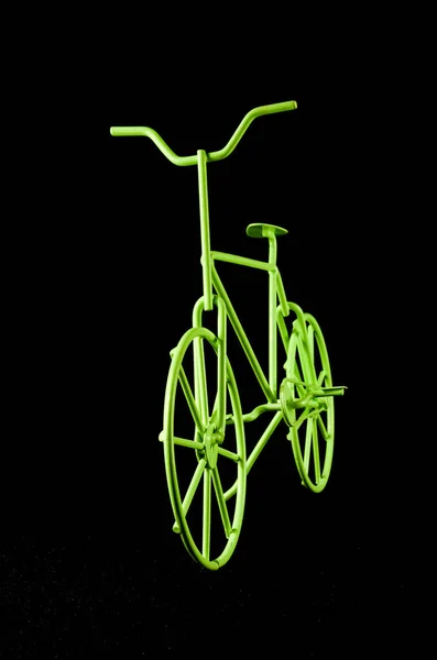 Vertical Closeup Shot Green Toy Bicycle Isolated Black Background — Stock Photo, Image