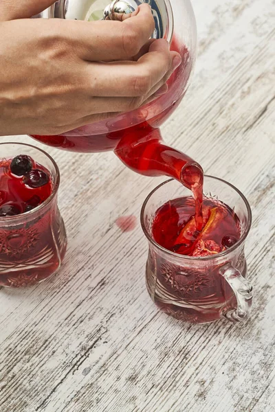 Fruit Tea Being Poured Glass Cup Wooden Table — Stock Photo, Image