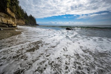 A High Angle shot of the ocean waves. Mystic Beach, Juan de Fuca Trail, Vancouver Island, BC Canada clipart