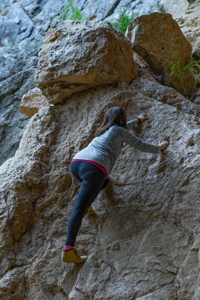 Young Girl Learning Rock Climbing High Mountain Blue Sweater Black — стоковое фото