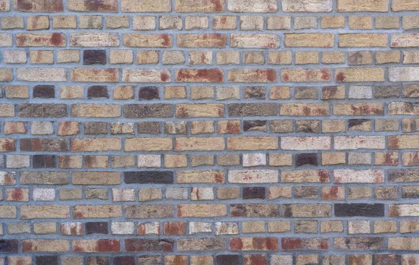 異なる石 トップビュー テクスチャを持つカラフルなクリンカーレンガの壁背景壁紙 — ストック写真