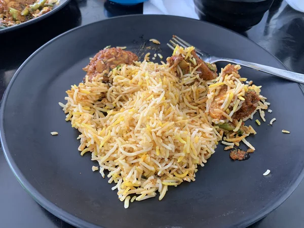 A portion of Pakistani Biryani with rice and meat