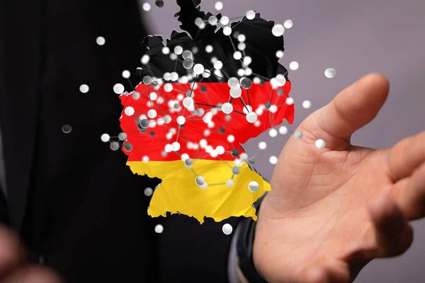 人間の手に浮かぶデジタルドイツ地図の3Dレンダリング インターネットとグローバル接続の概念 — ストック写真
