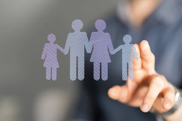 An illustration of a family cutout floating near a hand, adoption or foster care concept
