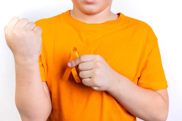 Boy Holding Kidney Cancer Awareness Orange Ribbon His Left Hand — Stock Photo, Image