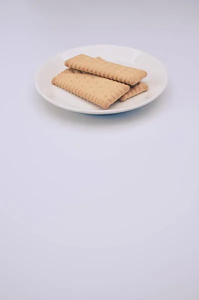 Λευκό Πιάτο Μπισκότα Λευκό Φόντο Αντίγραφο Χώρου — Φωτογραφία Αρχείου