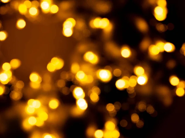 要旨ぼやけた背景 黄金のボケの光とフレア クリスマスの背景 — ストック写真