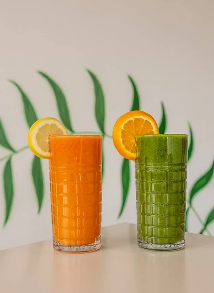 Glasses Fresh Carrot Cucumber Juices Decorated Lemon Orange Slices Table — Stock Photo, Image