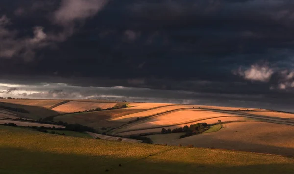 Aerial View Cultivated Fields Hills Rays Sun Dark Clouds Background — Stock Photo, Image