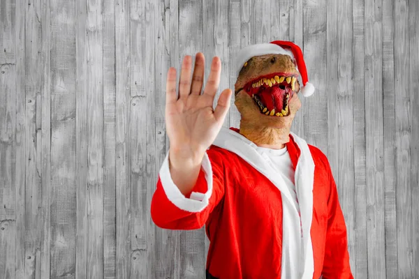 Shot Dinosaur Dressed Person Santa Claus His Hand Making Stop — Stock Photo, Image